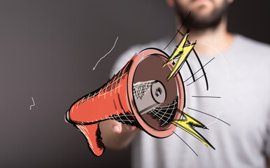 Hand holding a megaPhone, announcing news, marketing, communication, loud, powerful, attention