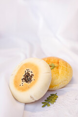 Two breads on a white background