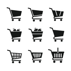 Shopping carts in various shapes and sizes arranged on white surface, representing retail, commerce, and consumerism, creating simple and clean aesthetic.