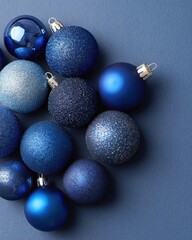 A Beautiful Arrangement of Blue Holiday Ornaments on a Textured Surface, Showcasing Various Shades and Finishes Perfect for Festive Decor
