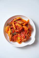 Indonesian homemade food tongkol balado. Fried tuna fish and potato with spicy red chili sambal
