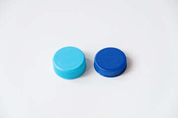 Blue water plastic caps for recycling isolated on white background