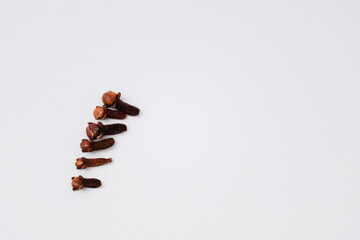 Close-up of dry clove buds isolated on white background