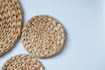 A round woven placemat made from natural water hyacinth isolated on white background
