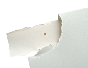 Torn paper reveals a bright interior. Textures and shapes create a visual focus