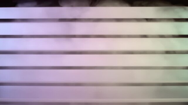 Dramatic fog rising between illuminated white parallel lines