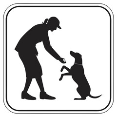 Woman training dog silhouette with treat dog training