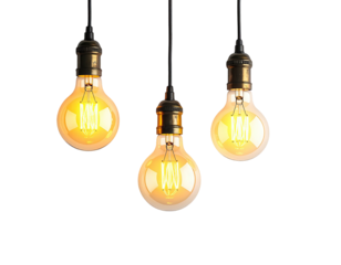 Three illuminated vintage-style light bulbs hanging against a black background