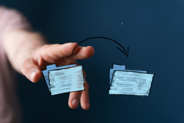 Illustrative image of a hand transferring digital files.  Perfect for technology, data, and...