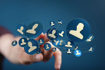 Hand touching a digital network of people. It represents connection, communication system and social media network concept.