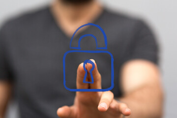 A hand interacts with a blue digital padlock icon, symbolizing cybersecurity, data protection, and online privacy. Ideal for technology and secu