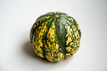 Close-up of pumpkin indoors against white background. Photo taken September 30th, Zurich Schwamendingen, Switzerland.