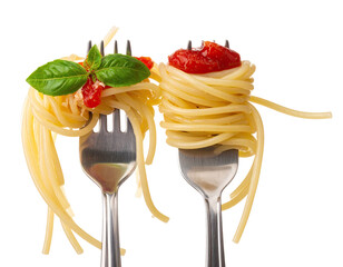 Two forks holding spaghetti pasta with tomato sauce and basil against a white background