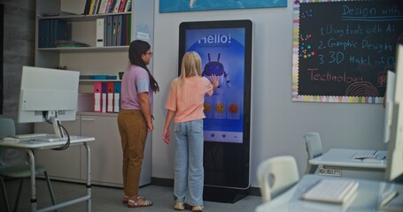 Blonde Schoolgirl Records Mood on AI Mood Tracker. After Lesson, Girls Identify Feelings. Concept of Using Educational Technologies, Modern Schools, and Caring For Children's Mental Health. Handheld.