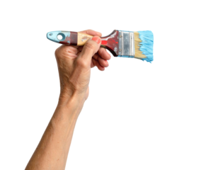 A hand holding a paint brush with blue bristles and a painted handle