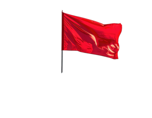 A vibrant red flag flies high against a stark black backdrop, catching wind