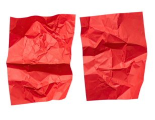 Two crumpled red sheets of paper, separated, against a stark black background