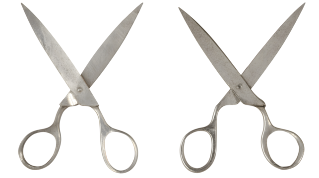 Two metallic scissors open on transparent png background