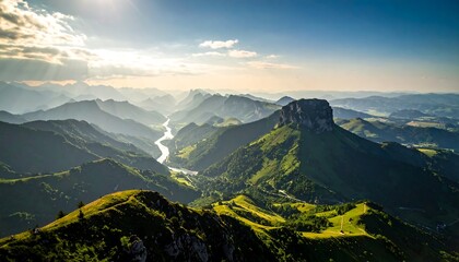Panoramic view of a sunlit valley, verdant mountains, and a winding river