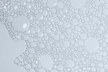 The texture of the foam of shower gel or soap suds. Macrophotography