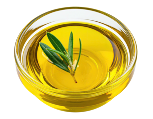 Glass bowl holding golden oil with a sprig of green leaves, against a black background