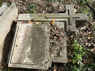 Old ruined tombstone in the public cemetery for children