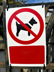 No dogs allowed sign on a fence