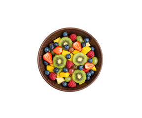 Bowl of healthy fresh fruit salad on wooden isolated on white background.Top view