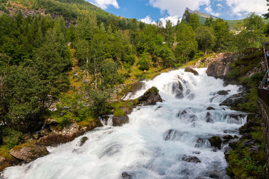 The Storfossen waterfall runs Geiranger center up to Norwegian Fjord Centre and has a drop down of 35 meters and combines wild nature, exciting views over the fjord and the power of water running down