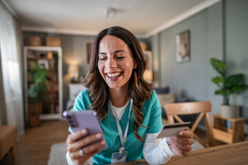 Nurse shopping online using phone and credit card