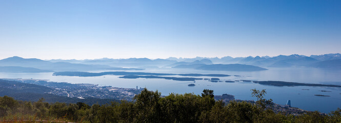 A fantastic view rom the Varden viewpoint over the Norwegian town of Molde, the fjord with the many...