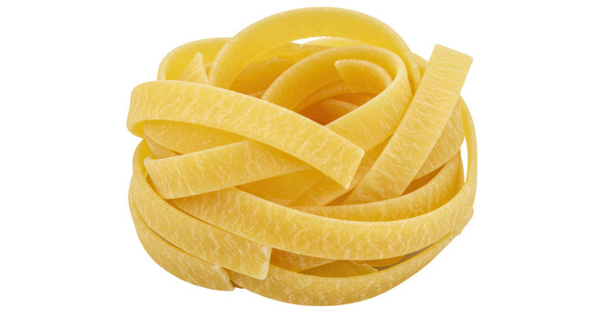 Dried tagliatelle pasta nest isolated, uncooked Italian ribbon noodle food ingredient for gourmet cooking and culinary arts