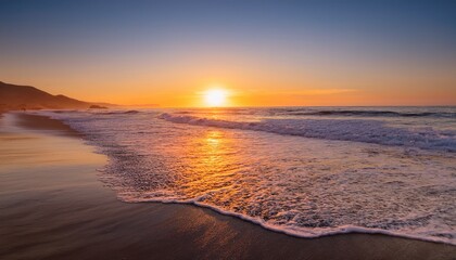 Sun Setting Over Ocean At Ventura Beach With Soft Waves And Orange Glow