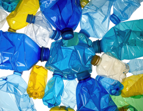 Crushed plastic bottles, various shades, top-down view, arranged in a jumbled pattern