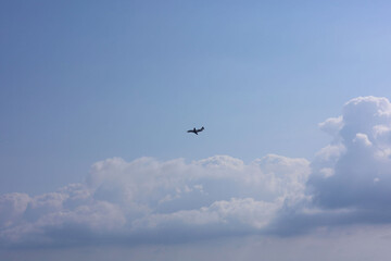 Airplane flying in beautiful blue sky, bottom view