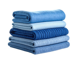 Stack of neatly folded textiles in varying shades of blue on a black background