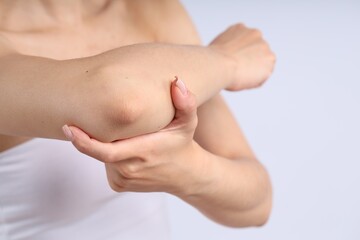Woman with normal skin on light background, closeup