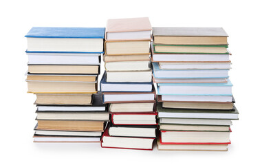 Stacks of many books isolated on white
