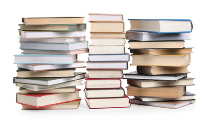 Stacks of many books isolated on white