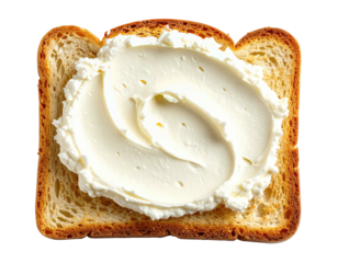 Close-up of toasted bread slice with generous swirls of smooth, white spread