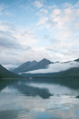 Early morning view of Lower Multinskoye lake, glacial lake surrounded by the Altai mountains, Russia