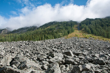 Picturesque Altai wilderness in late august with a huge stone river in the foreground, the Altai Republic, Russian Federation