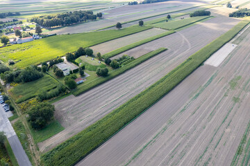 Aerial View of Farm Buildings and Cultivated Fields in Rural Poland
