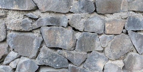 Stone wall texture background. Black stone wall texture. Black stone wall