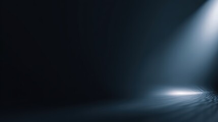 A dramatic spotlight illuminates a dark, atmospheric space, casting a bright beam and reflective patterns onto a textured ground, creating a mysterious and captivating scene, blurred blue background