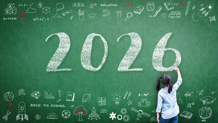 2026 Happy new year school class academic calendar with student kid's hand drawing greeting on teacher's green chalkboard for educational celebration, back to school, STEM education classroom schedule