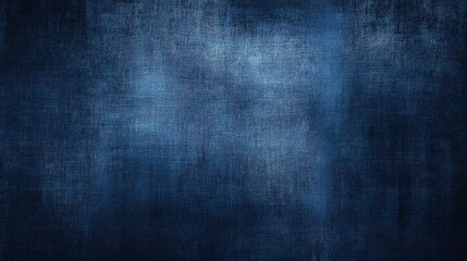 A dark blue textured background with a subtle gradient, appearing like woven fabric or a rough metallic surface, offering a versatile backdrop for design, blurred blue background