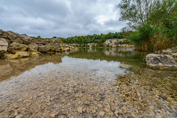 Zakrzowek, Krakow, Poland. Zakrzowek lake with steep cliffs in place of former flooded limestone quarry. New public recreational place.