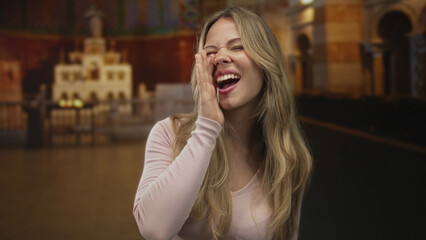 Woman blonde caucasian with open mouth shouting in front of church altar under candlelight; joy worship.