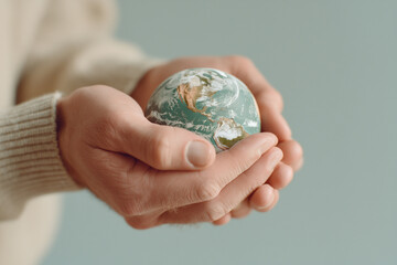 Fragile planet in persons hands
